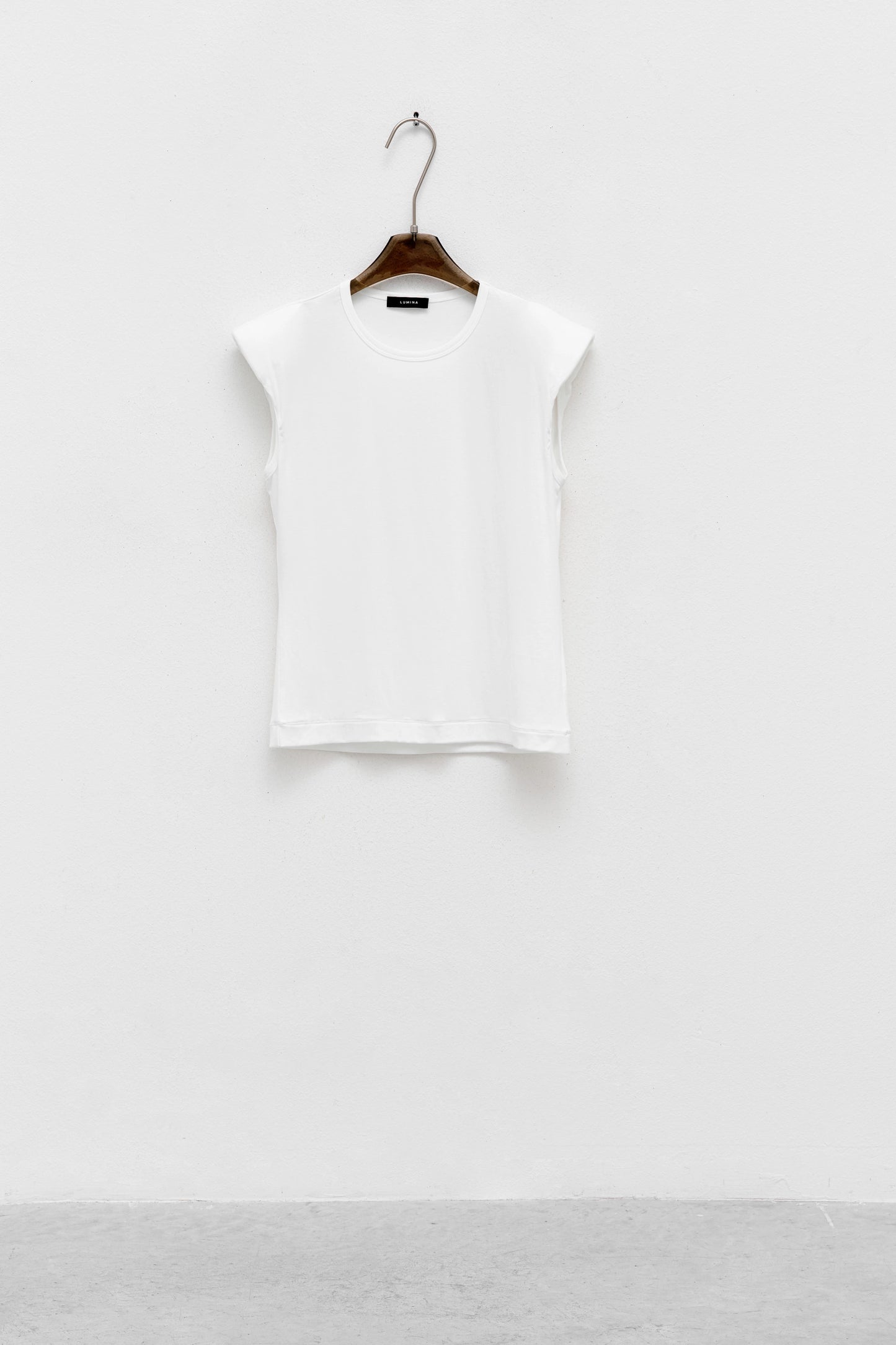 TOP CON SPALLINE IMBOTTITE